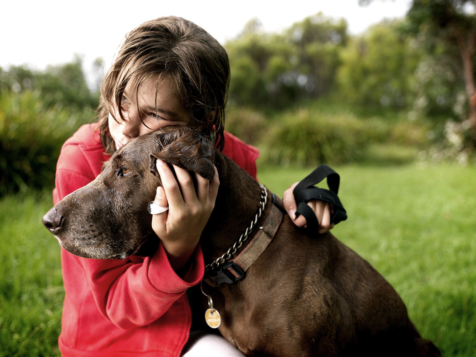 Girl hugging old dog